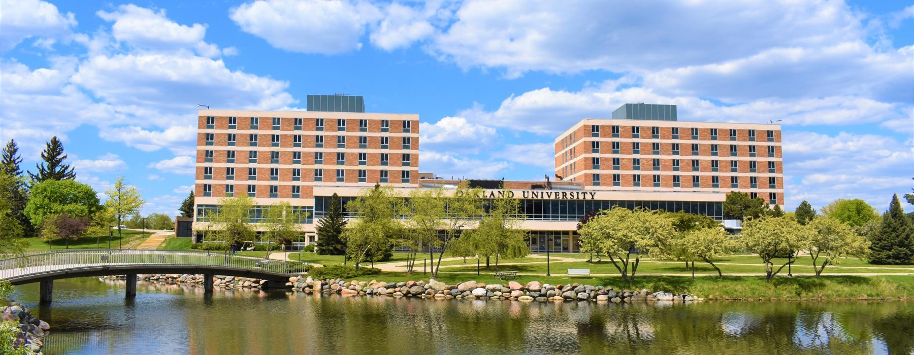 a body of water with buildings in the background